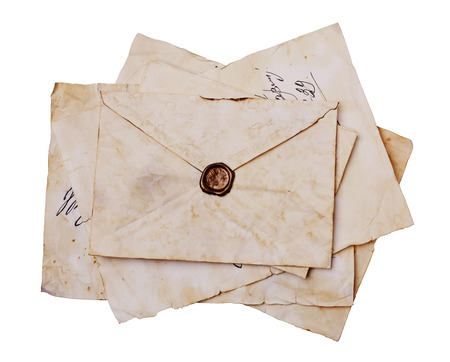 Old letters and envelope with seal wax isolated on whiteの写真素材