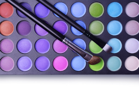 Professional palette of shadows and makeup brushes on a white backgroundの写真素材