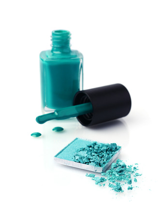 Teal cosmetics set with eyeshadows and nail polish isolated on whiteの写真素材