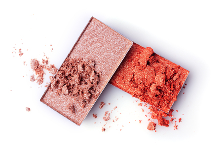 Beige and orange crushed eyeshadow isolated on white backgroundの写真素材