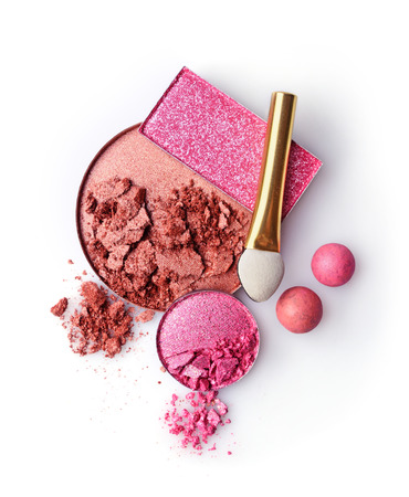 Beige and pink crushed eyeshadows and ball blush isolated on white backgroundの写真素材
