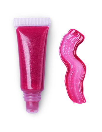 Pink lips gloss tube and stroke isolated on white backgroundの写真素材