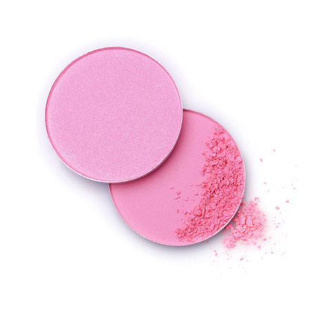 Pink crushed eye shadow or blush powder isolated on white background. Cosmetics products for makeup.の写真素材