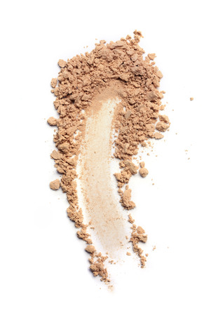 Smear of crushed beige face powder as sample of cosmetics product  isolated on whiteの写真素材