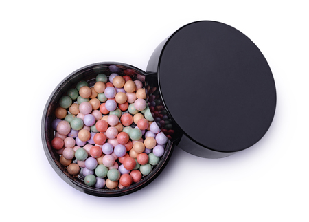 Multicoloured corrector face powder for make up in black box isolated on whiteの写真素材