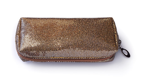 Full golden cosmetic bag isolated on whiteの写真素材