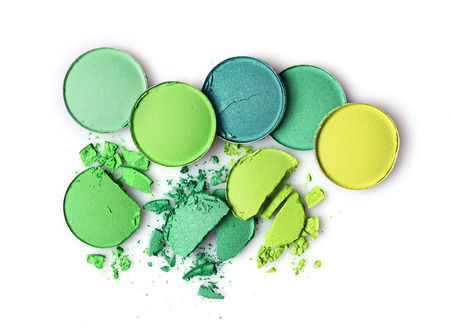 Round green crashed eyeshadows for make up as sample of cosmetics product isolated on white backgroundの写真素材