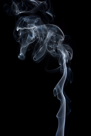 Transparented white cloud of smoke isolated on black backgroundの写真素材