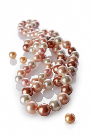 Luxury elegant colored pearl necklaces close-up isolated on white backgroundの写真素材