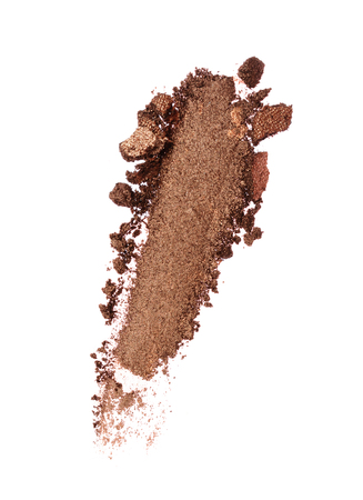 Smear of crushed shiny brown eyeshadow as sample of cosmetic product isolated on white backgroundの写真素材