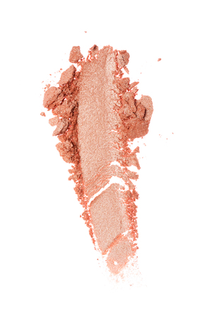 Smear of crushed beige eyeshadow as sample of cosmetic product isolated on white backgroundの写真素材