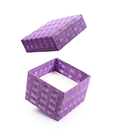 Beautiful purple flying open shiny gift box isolated on white backgroundの写真素材