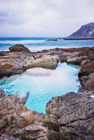 Beautiful Norway landscape of picturesque stones on the arctic beach of Lofoten islands in cold Norwegian Sea, Norwayの写真素材