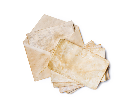 Mockup of old vintage paper envelopes and yellowed sheets or post cards with clip isolated on white backgroundの写真素材