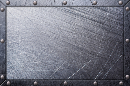 Background of gray grunge scratched metallic nameplate in frame on rivets for designの写真素材