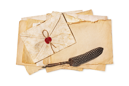 Vintage composition with yellowed letters in envelope and luxury quill pen isolated on white backgroundの写真素材