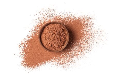 Top view of cocoa powder in white bowl as ingredient for confectionery isolated on white background