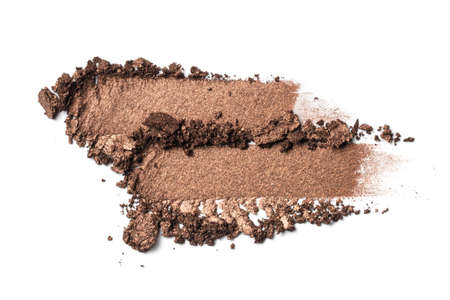 Flat lay of brush strokes. Broken eyeshadow as samples of cosmetic beauty products isolated on white backgroundの写真素材