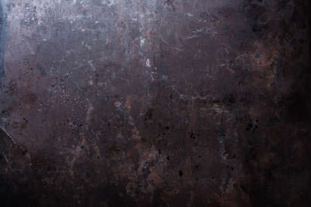 Dark grunge metallic texture background with rust for designの写真素材