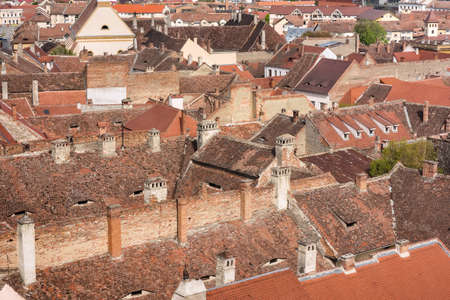 Cityscape of roofs with eyes in historical center of Sibiu town Transylvania, Romaniaの写真素材
