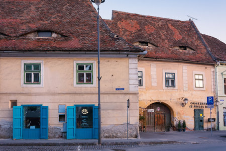 Sibiu, Transylvania, Romania - April 24, 2022: cityscape with beautiful old buildings with eyes in historical centerのeditorial素材