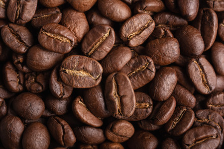 Flat lay background of roasted coffee beans as ingredient for morning espresso and other tasty drinksの写真素材