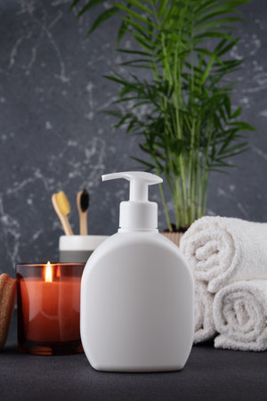 White empty shampoo or lotion bottle for mock-up in modern dark bathroom interiorの写真素材
