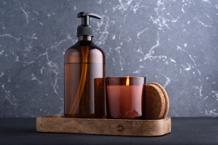 Spa composition with burning candle and recycled dispenser bottles for natural cosmeticの写真素材