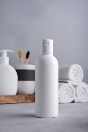 White empty shampoo or lotion bottle for mock-up in Scandinavian bathroom interiorの写真素材