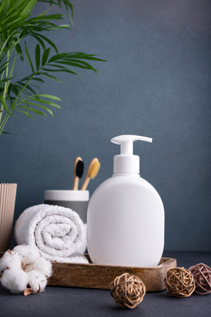 White empty shampoo or lotion bottle for mock-up in modern dark bathroom interiorの写真素材