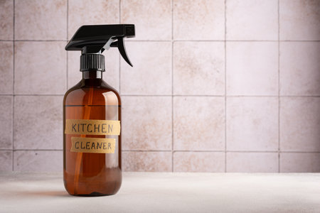 Eco friendly concept, sustainable lifestyle. Spray bottle of kitchen cleaner on tile background with copy spaceの写真素材