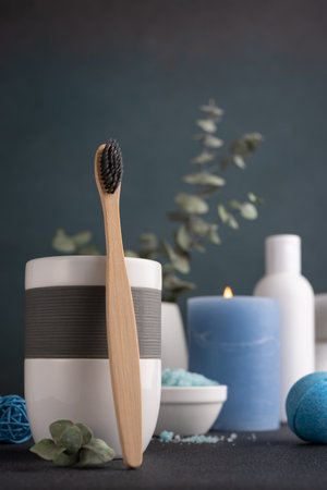 Bamboo toothbrush and other bathroom accessories. Wellness and spa concept.の写真素材