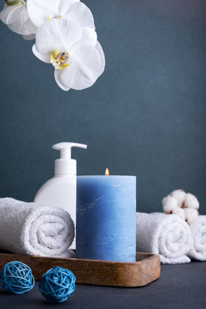 Home decoration and interior. Beautiful burning candle and bathroom accessories.