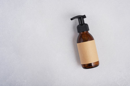 Brown glass bottle for cosmetic product mock up. Natural organic cosmetic concept.の写真素材