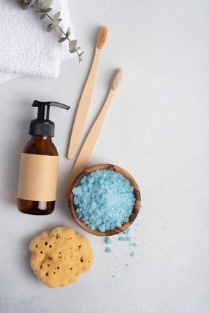 Eco-friendly bathroom accessories: bamboo toothbrushes, natural sea sponge and bath salt. Zero waste spa and bath products.の写真素材