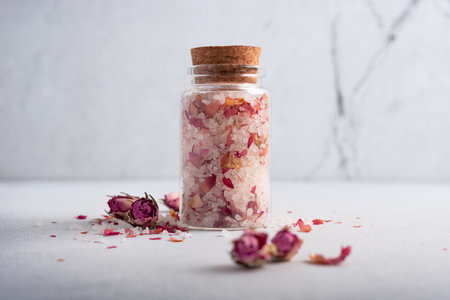 Homemade herbal bath salt with roses petals. Skincare spa beauty bath cosmetic products for relax.の写真素材