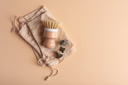 Eco wooden dish brush and cotton bags. Zero waste concept. Multi functional kitchen cleaning tool...