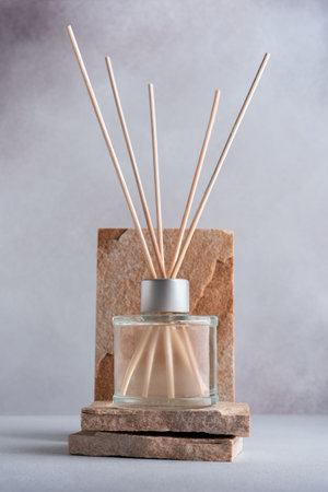 Home fragrance diffuser with reed sticks on stone podium for mock-up
