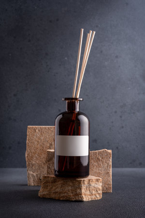 Reed aroma diffuser bottle on the stone podium for mock-up and brandingの写真素材