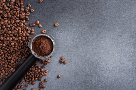 Portafilter with a ground coffee and coffee beans topview. Coffee background.の写真素材