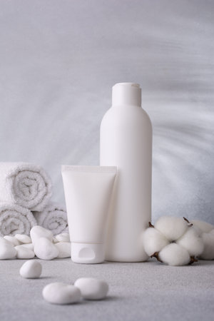 Cosmetics packaging . Plastic cosmeticâs bottle and tube of cream and shampoo. Bath product mock-up. Beauty spa product concept.の写真素材