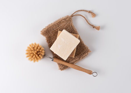 Handcraft organic soap bar with cleaning brush and washcloth, top view. Healthy lifestyle and wellness concept.の写真素材