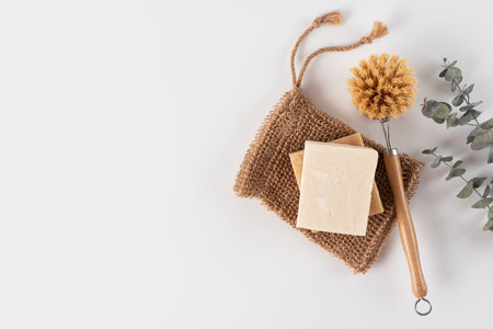Handcraft organic soap bars with cleaning brush and washcloth, top view. Healthy lifestyle and wellness concept.の写真素材