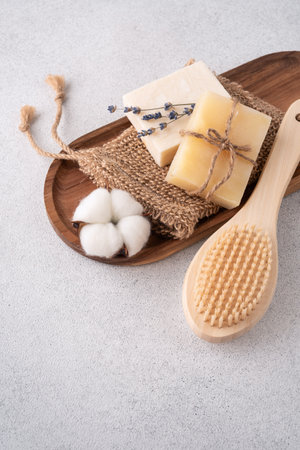 Handcrafted soap bars, wooden massage brushes, washcloth and lavender flowers. Set for eco friendly bathroom and bodycare concept.の写真素材
