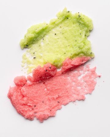 Cosmetic swatches of red and green body scrub, close-up. Beauty natural cosmetic concept for body care.の写真素材