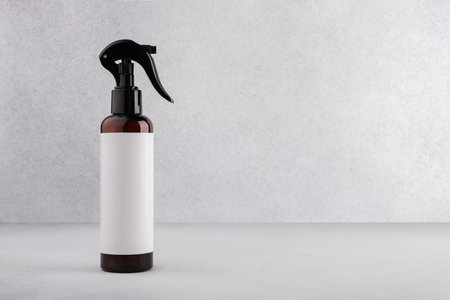 Brown cosmetic trigger sprayer bottle with blank labels mockup.の写真素材