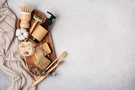 Eco-friendly and sustainable beauty and skincare products on a neutral background. Wooden brush, bamboo toothbrushes, bottles, and natural soap bars. Perfect for zero-waste, sustainable lifestyle concept.の写真素材