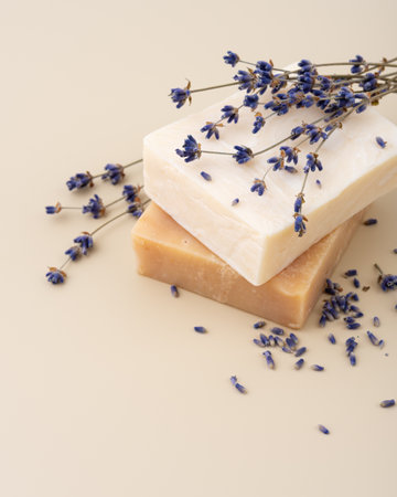 Handmade natural soap bars with lavender extract on a beige background. Perfect for wellness, spa, organic skincare, aromatherapy, and romantic beauty concepts.の写真素材