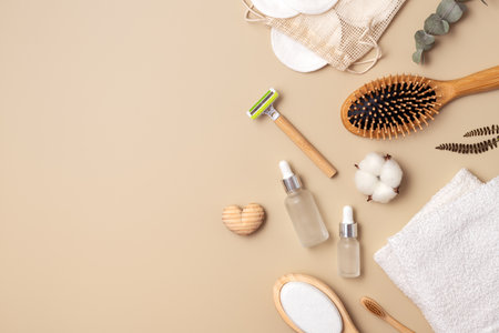 A collection of eco friendly personal care items including a toothbrush, hair brush, razor, cotton pads and a glass dropper bottles. Zero waste, Plastic free, Sustainable lifestyle concept.の写真素材