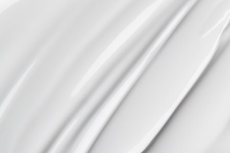 Close-up of white glossy cosmetic texture, resembling gel polish or creamy skincare product. Smooth, abstract background for beauty, spa, and skincare concepts. Clean and minimal aesthetic.の写真素材